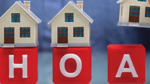 Toy houses and blocks spelling HOA